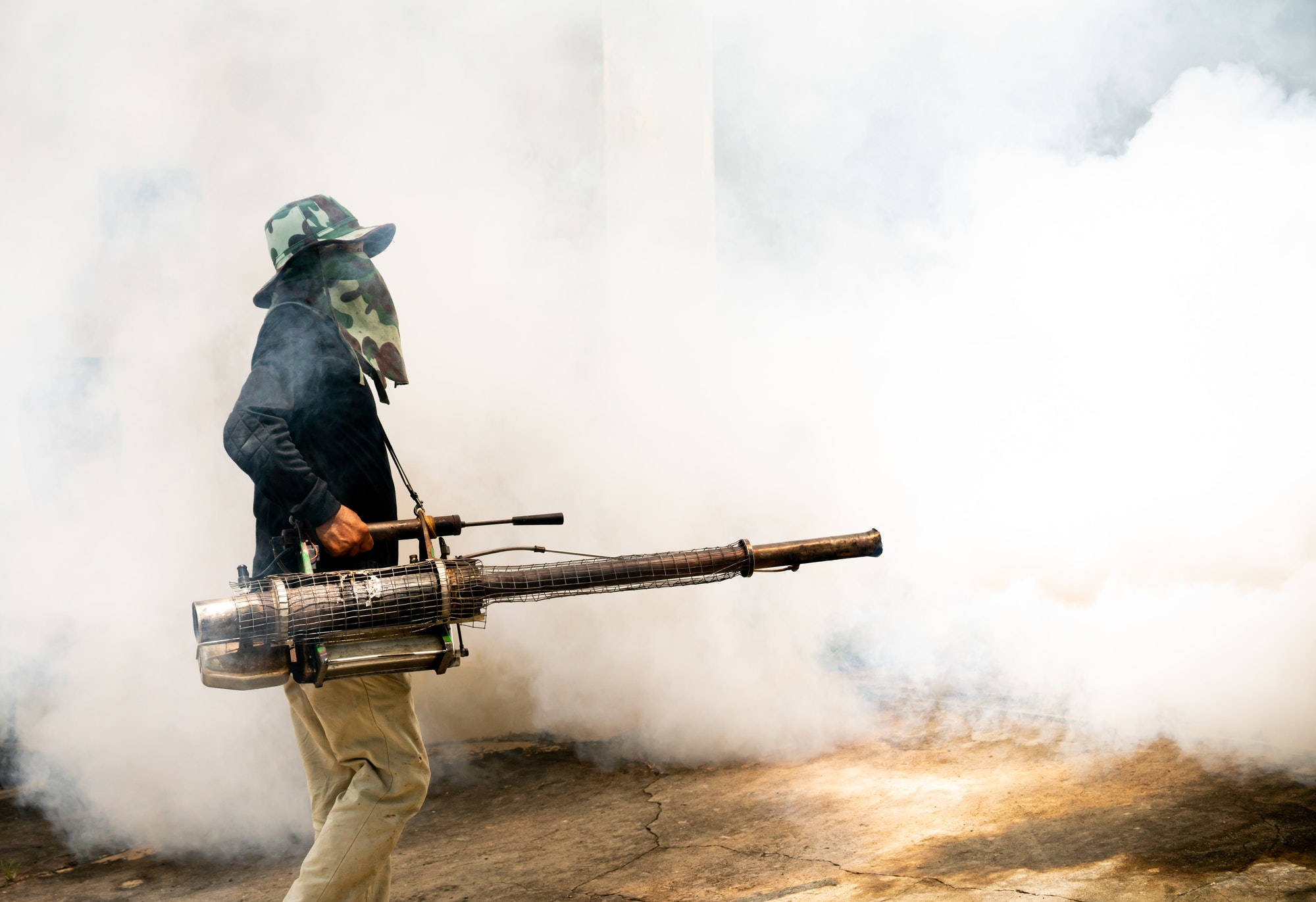 man use fumigation mosquitoes machine for kill mosquito carrier of Zika virus and dengue fever